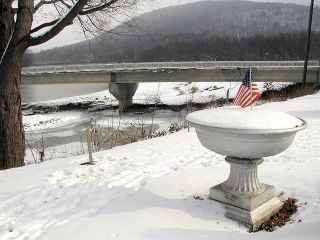 Wintry scene by the Susquehanna; monument is adjacent to stake.