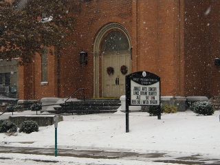 The church doors, decorated for Christmas