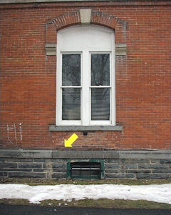 The bench mark disk is located on the northeast side of the courthouse.