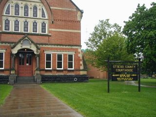 View of the courthouse from the sidewalk along Main Street.