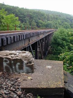 M 140 on the northeast corner of the southeast bridge abutment.