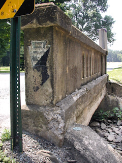 Looking south along SR 3001. The mark is on the northwest wingwall of this bridge.