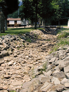 Looking west from the mark over the (now dry) White Brook.