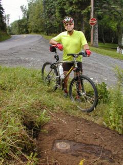 Orientation view of station mark at road intersection.