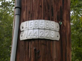 Power pole identification numbers.