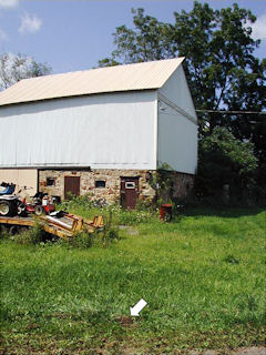 The station mark just off the road, and the barn to the north.