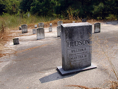 Near the parking area you'll see this odd graveyard; the headstones rest on a concrete slab!