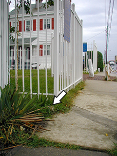 Eyelevel view of the post at the SW corner of the fence