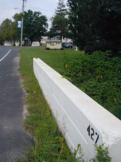 Looking west along the bridge and Route 26. The mark appears on the far end.