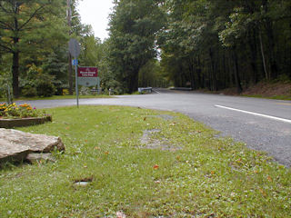 View facing southwest, showing the boulder, mark and Lentz Trail.