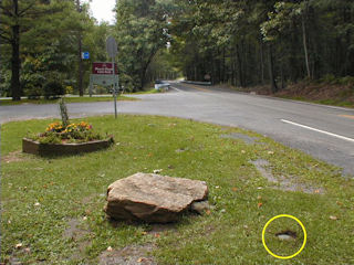 Orientation view, facing southwest, park sign and flat boulder. Mark indicated.