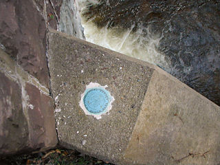 Looking down at the northwest wingwall and the mark.