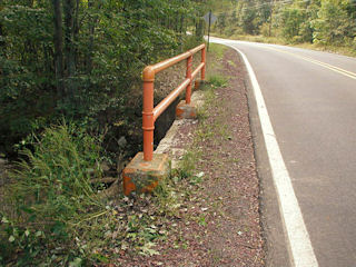 Looking west along the south bridge railing and County Road 41.