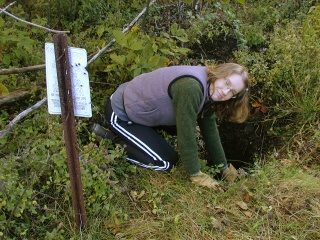 Zhanna, digging away to uncover the station mark.