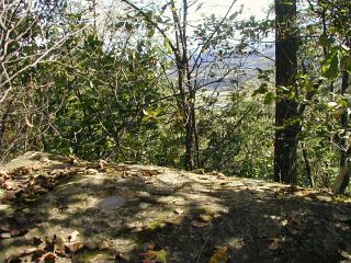 Overlooking the valley and farmland to the east.