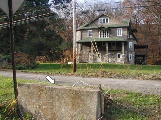 Looking NW at house and powerpole 134.