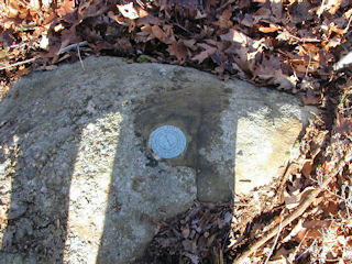 Eye-level view of the reference mark on the boulder.