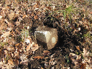 Eyelevel view of the disturbed monument and azimuth mark