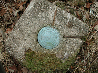 Overhead close-up of monument and nails.