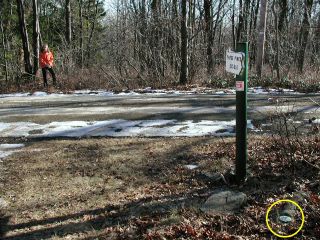 View east, Zhanna at trailhead, mark indicated.