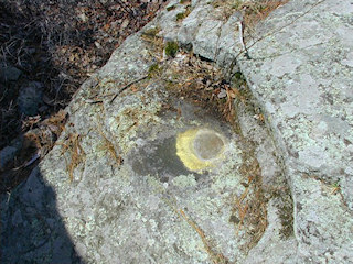 Eyelevel view of Q 235 on the ledge of the boulder.