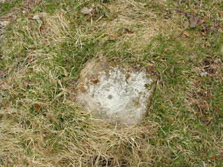 Eye-level view of monument & stem of missing disk.