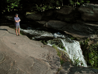 Top of the falls where it goes over the ledge.