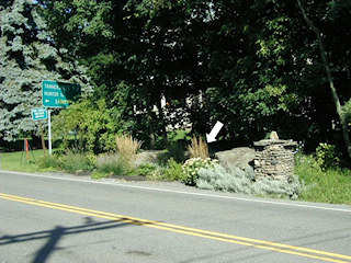 Facing NNW, standing on S side of Route 23A.