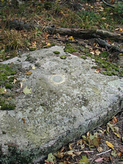 Eyelevel view of the reference mark disk on the boulder.