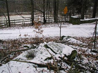 Looking southeast toward Killroe Road, at the Y intersection. The wire fence and stone wall are in the background.