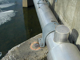 An eye-level view of the disk on the bridge abutment.