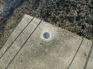 Eyelevel view of mark on bridge abutment.