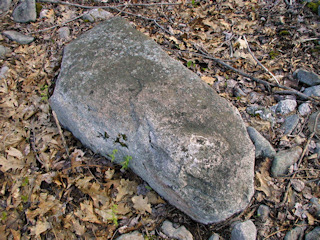 Eye-level view of the chiseled square on the boulder.