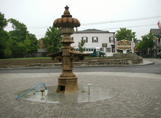 What remains of the fountain in June 2005. The fountain base and rim were removed.