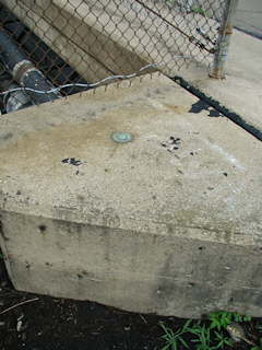 Eyelevel view of the disk on the bridge abutment.