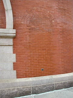 The mark is set in what appears to be a doorway or window that was bricked-over long ago.