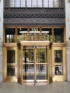 Ornate entrance shows address “233” (Broadway).