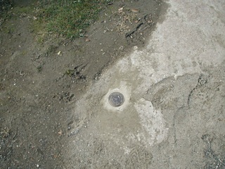 Eyelevel view of the disk set in the rock outcrop.