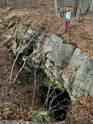 Zhanna hangs on tight above the second deep shaft of the Winston Mine. This one was filled with water.