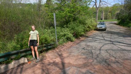 Looking NE along Hendershot Rd. (T 495). Zhanna stands near the mark.