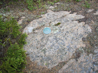 Eyelevel view of RM 2 on bedrock ledge.