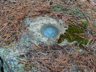 Eyelevel view of the disk on the rock ledge.