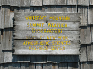 Sign on weather observation tower.