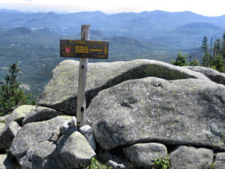 Looking SE toward mark and trail sign.