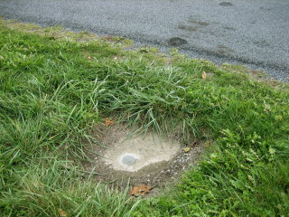 Eyelevel view of the azimuth mark set in concrete pad.