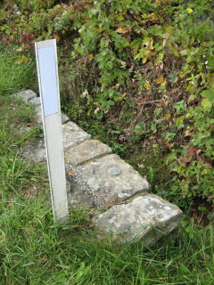 The culvert is marked with a reflector for easy visibility.