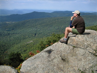 Rich relaxes on a ledge just off the A-T.