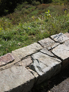 Station disk E of the stone wall at Thorofare Mtn Overlook.