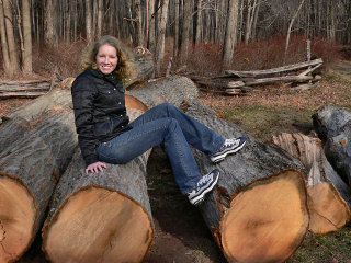 Zhanna stops to rest after chopping down a few trees. All in a day's work!