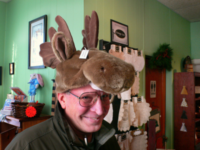 Reluctantly Rich tries on this moose hat. I happen to think it's adorable!